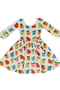Dress with colorful apple pattern on a white background