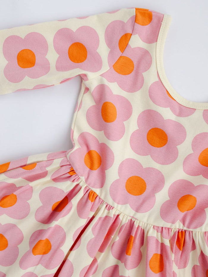 Dress with pink floral pattern on a white background