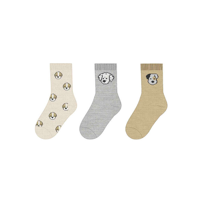 Three pairs of socks with dog designs on a white background