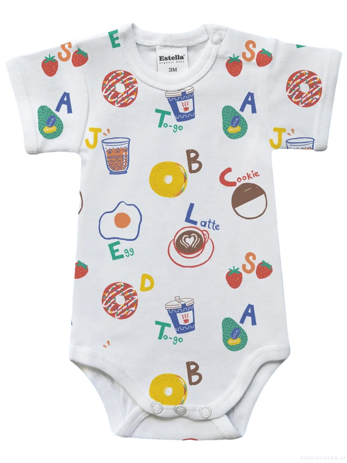 Baby onesie with colorful alphabet and food graphics on a white background