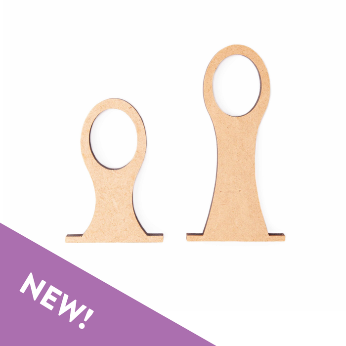 Two wooden letter 'T' shaped items with a purple 'NEW!' banner on a white background