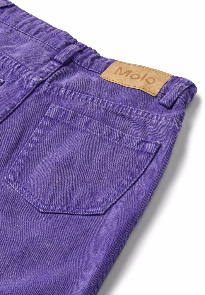 Purple pants with a visible brand label on a white background