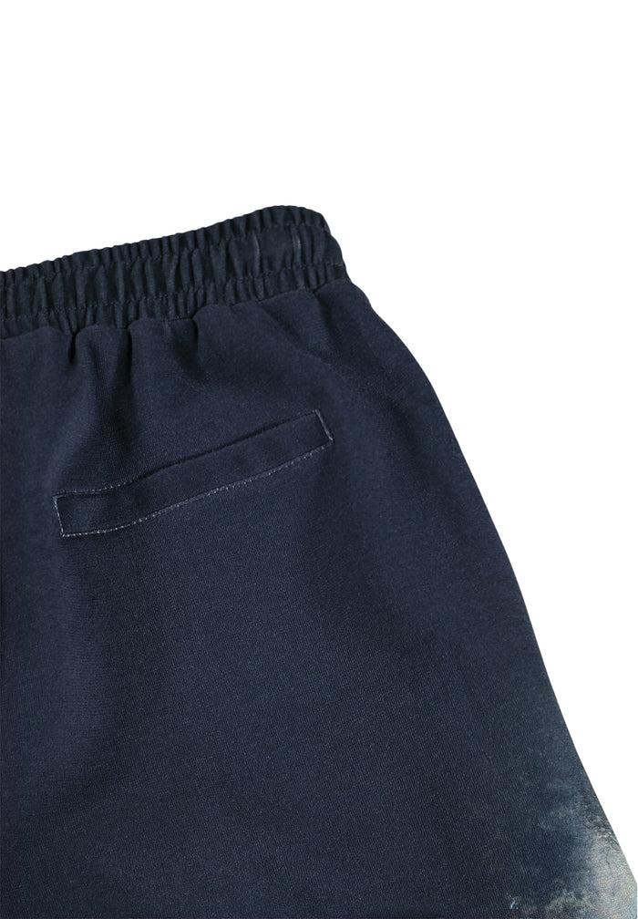 Navy blue sweatpants with a pocket on a white background