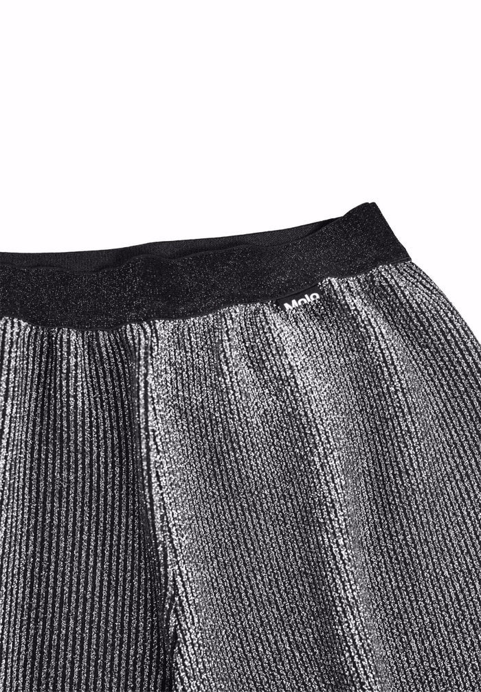 Close-up of a textured black and gray fabric with a brand logo on a white background