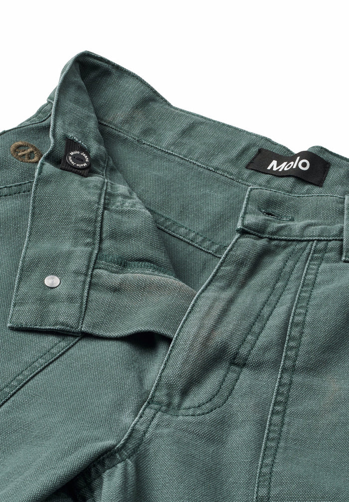 Green jacket with 'Molo' brand label on a white background