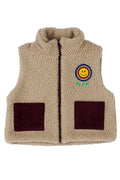 Beige fleece vest with a smiley face patch on a white background