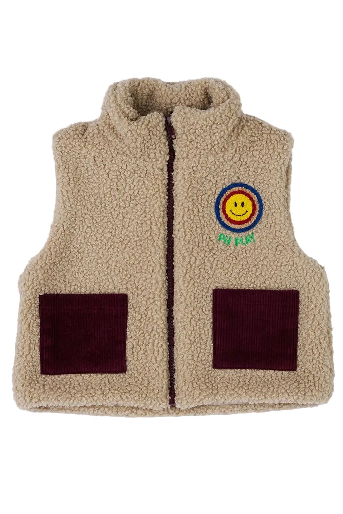 Beige fleece vest with a smiley face patch on a white background