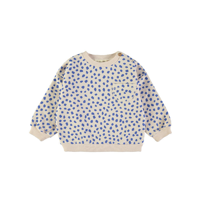 A long-sleeve crewneck sweatshirt for children, featuring a blue hand-drawn dot pattern on a cream-colored base, with ribbed cuffs, hem, and collar, and a chest pocket.