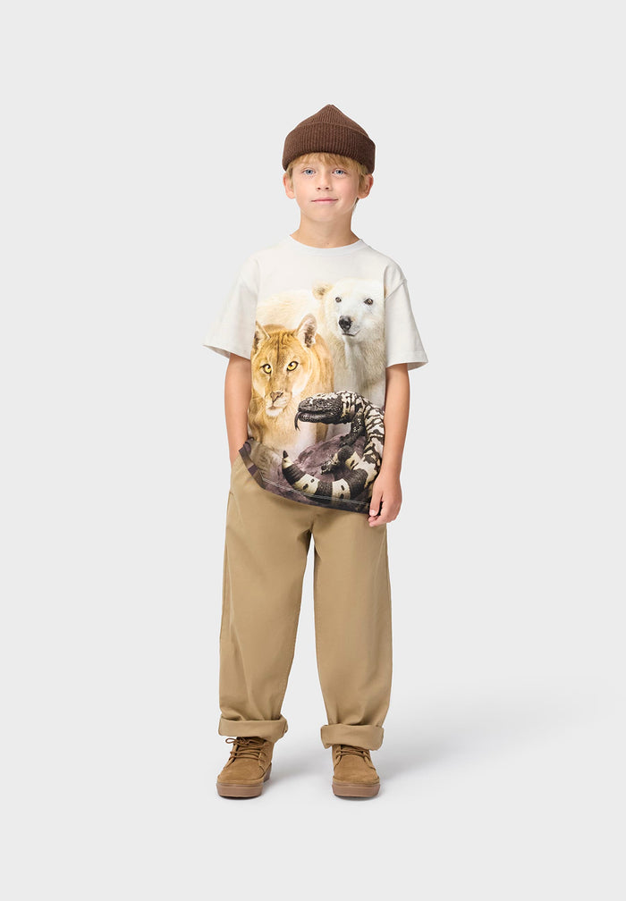 Child wearing a t-shirt with a wolf design on a white background