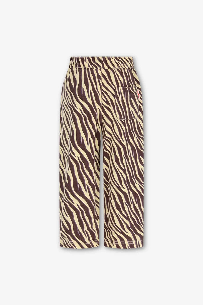 back view of yellow and brown zebra stripe pants with side patch pocket on white background