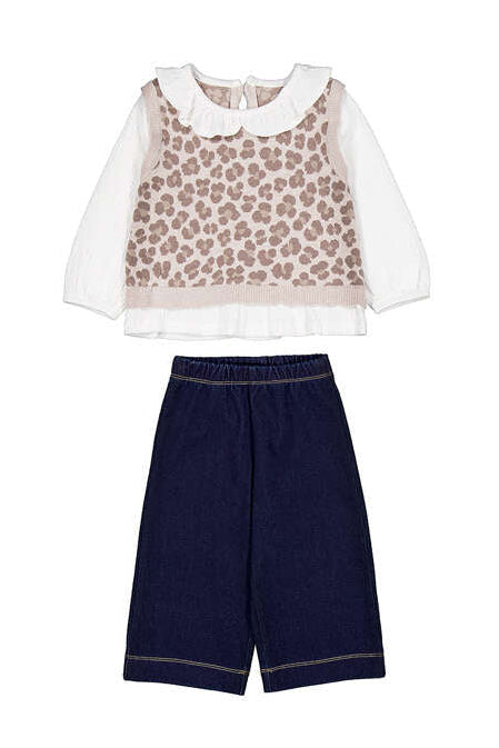 Children's outfit with leopard print top and navy pants on a white background