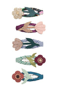 Five fabric hair clips arranged vertically on a white background, each featuring a different floral and leaf design in muted colors including teal, pink, green, burgundy, and glittery gold.