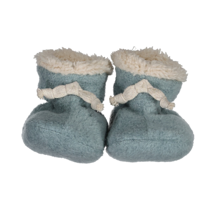 Pair of blue baby booties with white fur trim on a white background