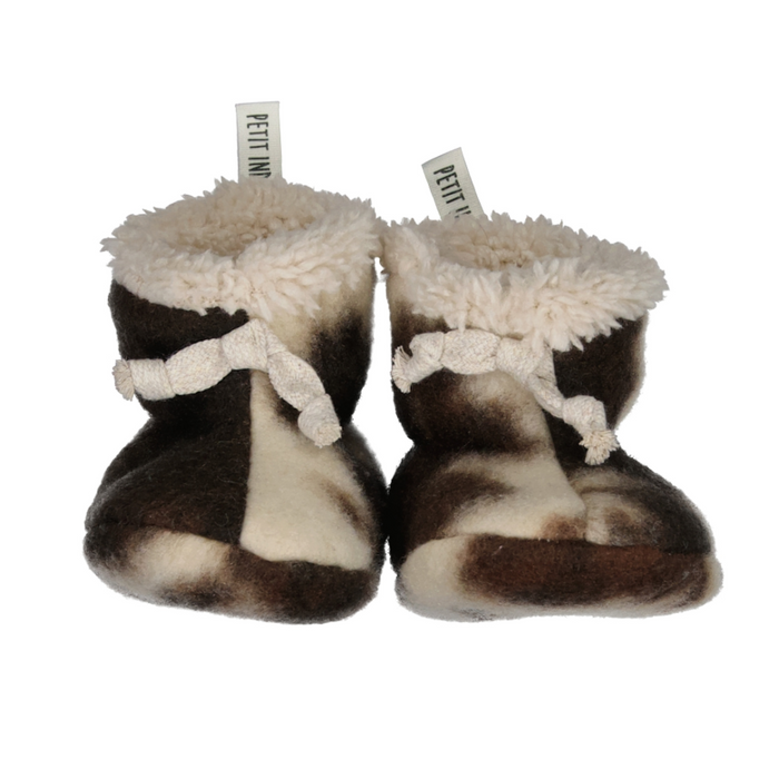 Pair of brown and white baby booties with fluffy texture on a white background
