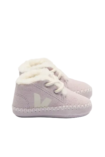 Pair of light purple baby shoes with white laces on a white background
