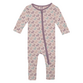 Baby onesie with balloon dog pattern and purple zipper on a white background