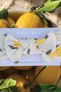 Lemons with a headband featuring lemon design and 'forever french' branding.