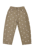 olive pants with white floral pattern on a white background