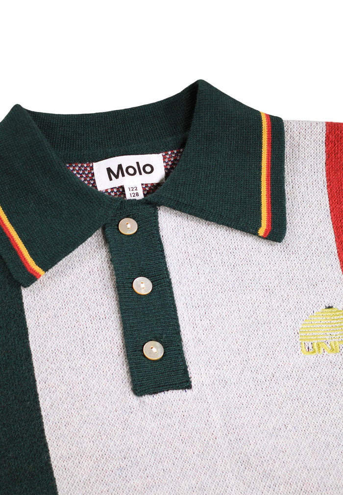 Close-up of a polo shirt with a brand label on a white background