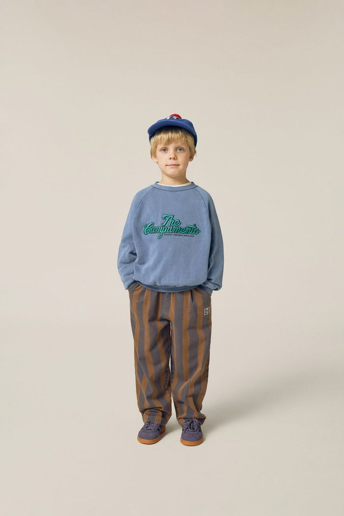 child wearing The Campamento Sweatshirt with striped trousers