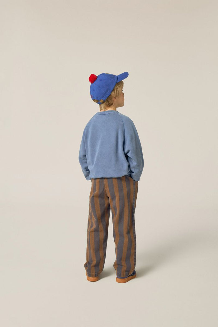 child wearing striped trousers