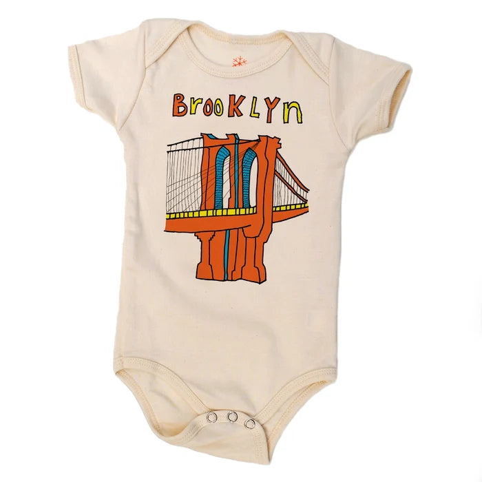 Baby onesie with Brooklyn Bridge graphic and 'Brooklyn' text on a white background