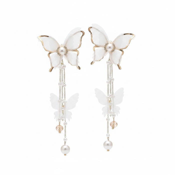 Elegant long drop earrings featuring white tulle fabric butterfly wings with gold-tone edges, accented by delicate pearl chain tassels and crystal droplets on a white background.