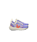 A pair of low-top athletic sneakers in a light purple and cream mesh upper, featuring a prominent orange V-shaped logo on the side, cream laces, and a thick cream midsole, photographed against a clean white background.