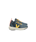 Pair of blue and yellow sneakers on a white background