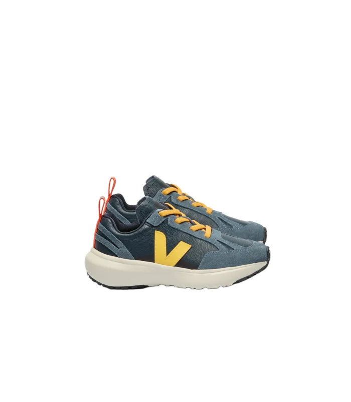 Pair of blue and yellow sneakers on a white background