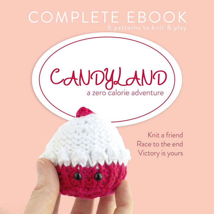 Candyland Complete Ebook cover on a peach background showing a hand holding a knitted cupcake amigurumi with a red base and white frosting top with safety eyes, text reads 6 patterns to knit and play, a zero calorie adventure