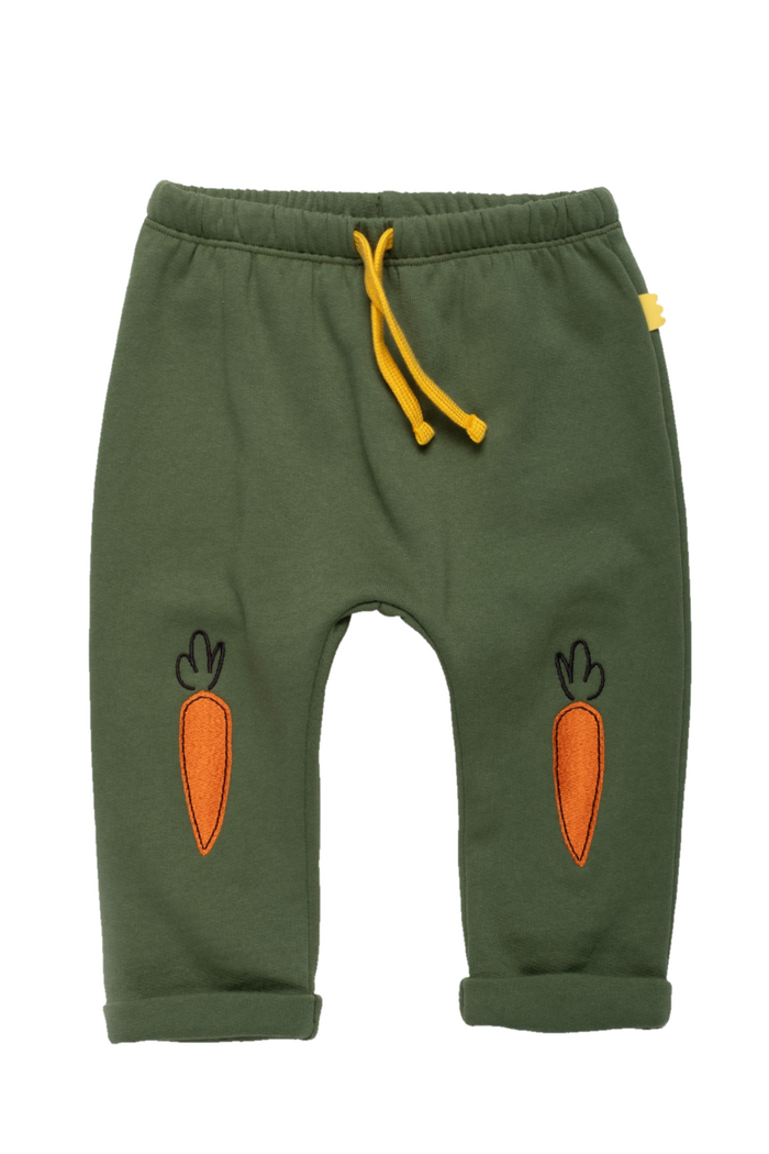 Green children's sweatpants with orange carrot graphics on the legs and a yellow drawstring, shown flat on a white background.