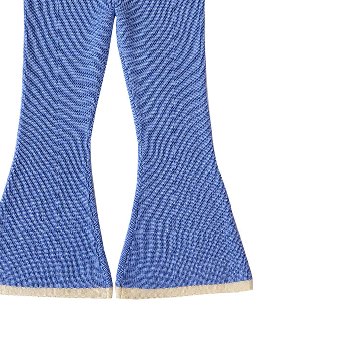 Blue bell-bottom pants with beige trim on a white background
