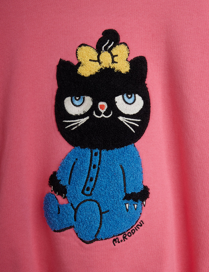 Embroidered black cat with a yellow bow on a pink background