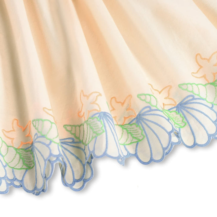 close-up of skirt with embroidered seashells detail