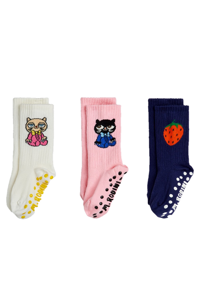 Three pairs of socks with cartoon characters on a white background