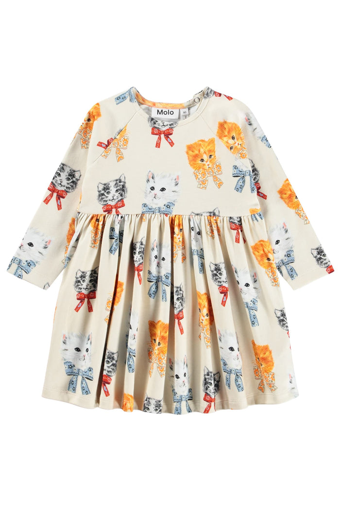 Children's dress with cat and bow pattern on a white background