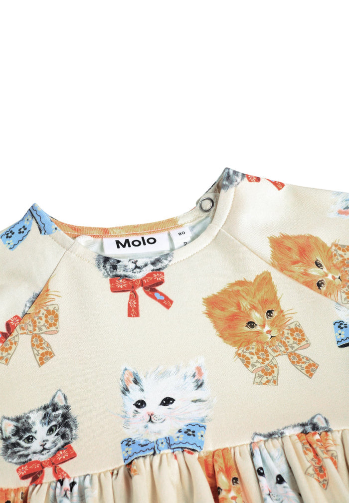 Children's dress with cat print and Molo branding on a white background