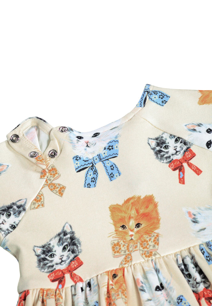Children's dress with cat print on a white background