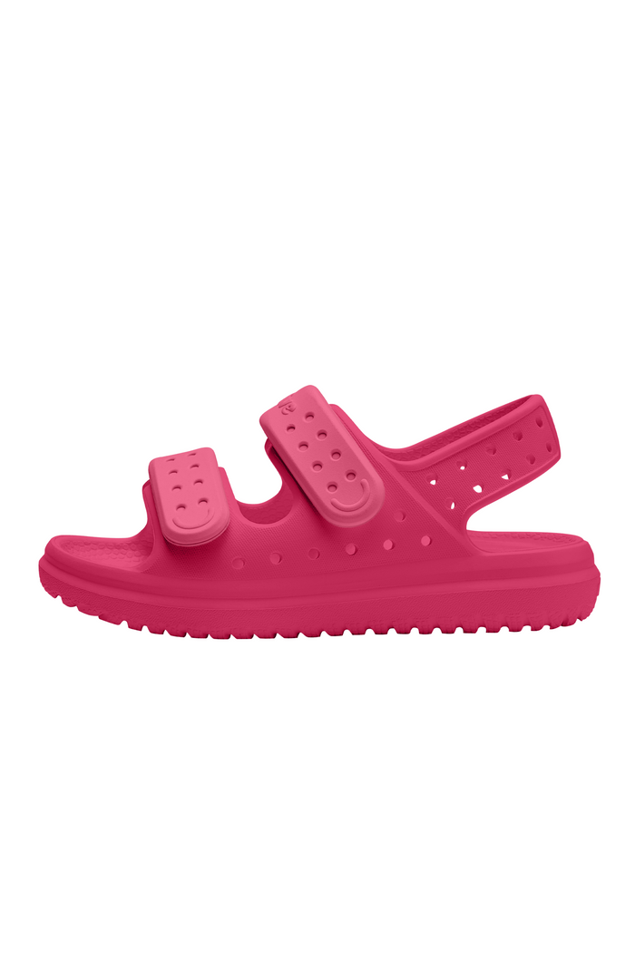 Pink sandal with double straps on a white background