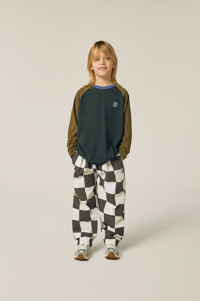 Child wearing checkered trousers