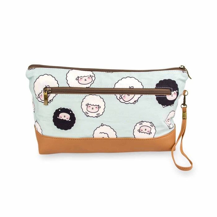 Back view of the Chubby Sheep Trinity Bag showing the exterior zippered accessory pocket with the same seafoam sheep print, tan vegan leather bottom, and wrist strap