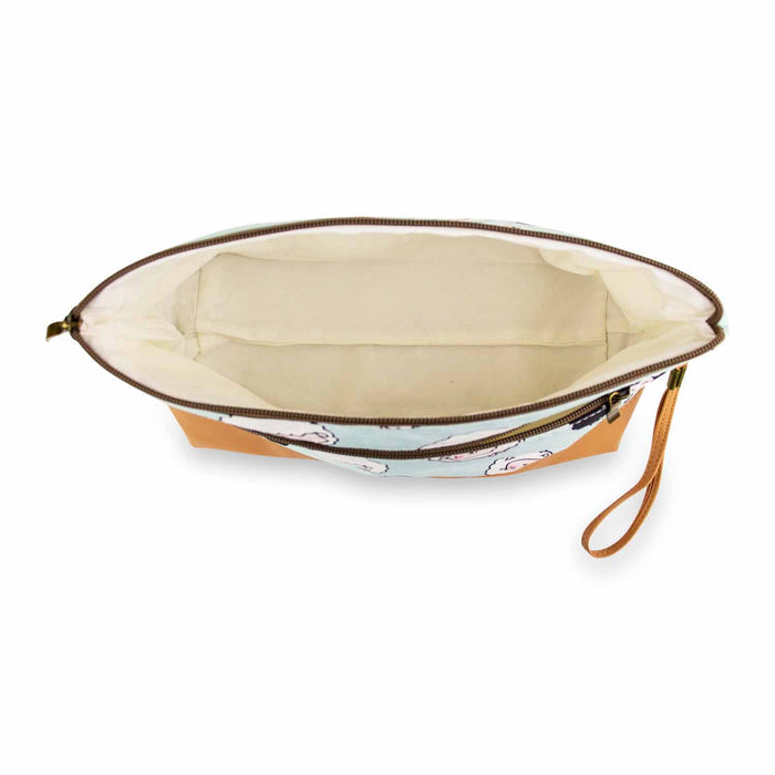 Top-down view inside the Chubby Sheep Trinity Bag showing the cream cotton lining and interior accessory pocket
