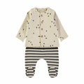 baby two pieceset. beige cardigan with brown buttons and black shapes printd throughout. black and beige striped footed pants on white background.