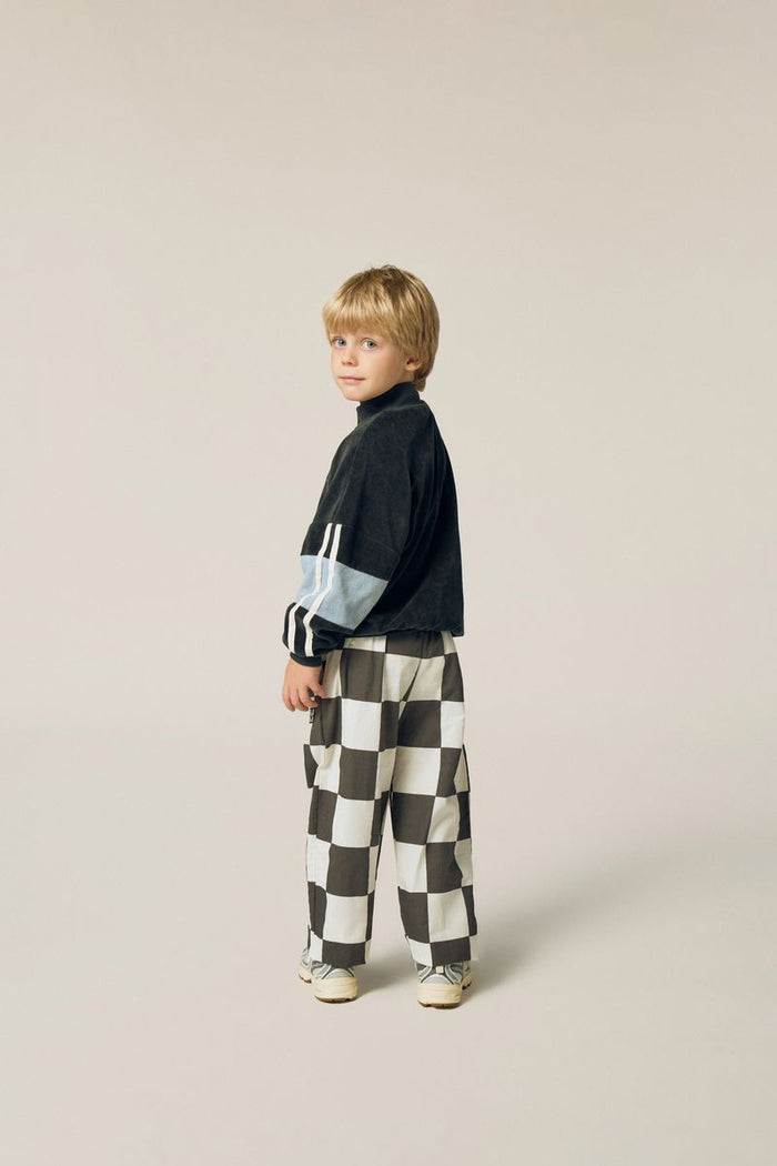 Child wearing Color Block Sweatshirt and Checkered Trousers