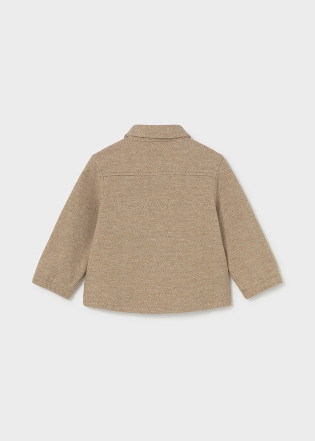 Beige jacket on a white background
