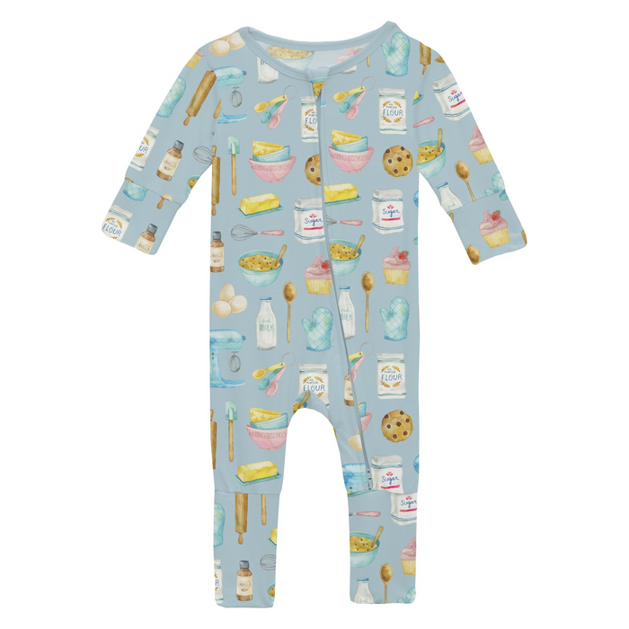 blue zip romper with multi color baking themed print all over on white background.