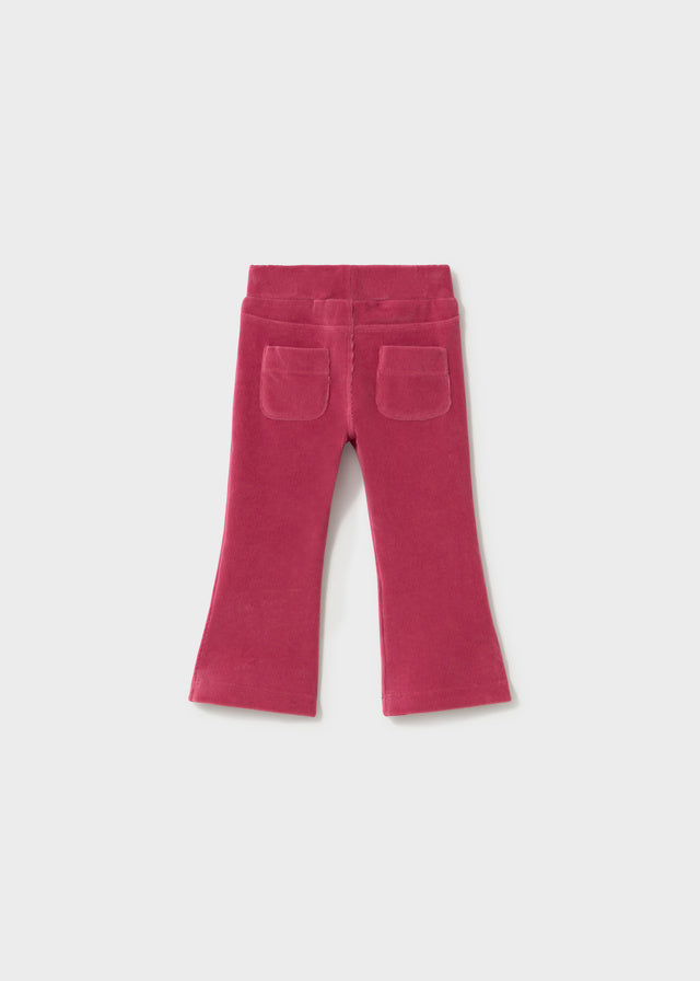 Pink flared pants on a white background