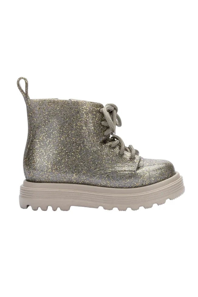 Silver glitter boot on a white background