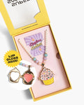 Set of lip gloss, necklace, and compact mirror in a yellow box with 'Super Smalls' branding.